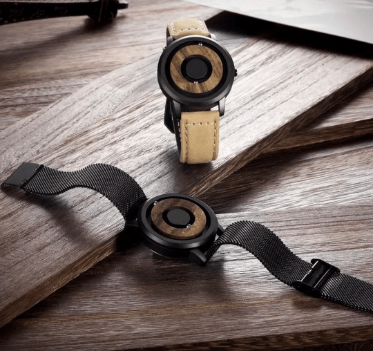 side view of retro mechanical magnetic ball wooden watch
