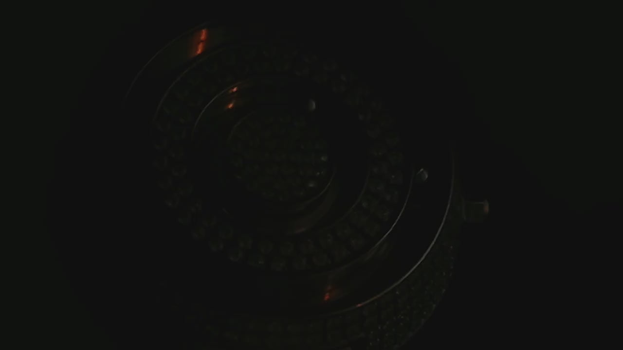 close-up of magnetic ball bearings on steel watch dial