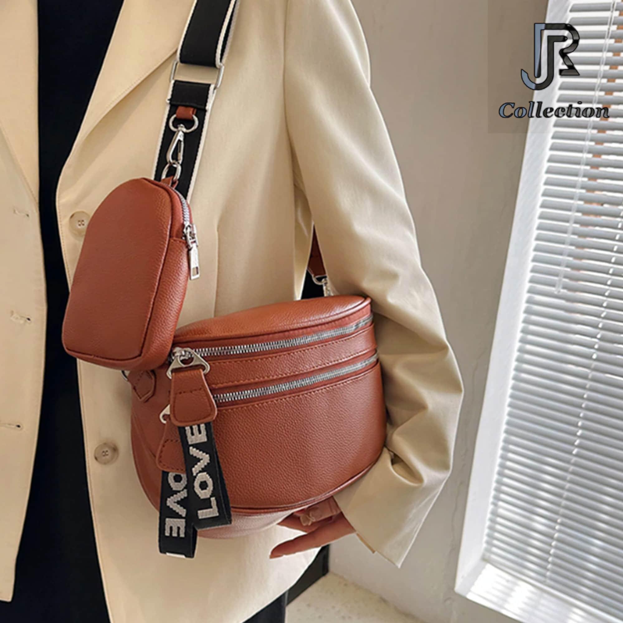 model wearing women’s leather shoulder crossbody bag